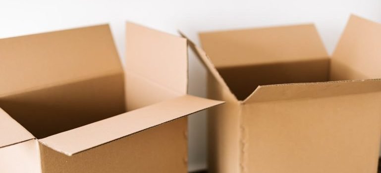 Two cardboard boxes for items that should be taken to commercial storage for NYC enterprises