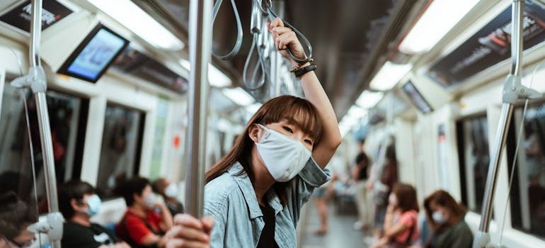 A person traveling by subway train