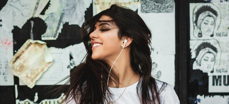 A woman enjoying some music.