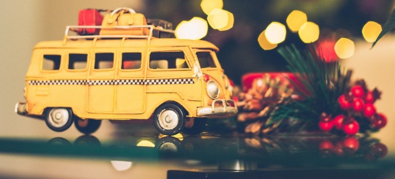 Selective Focus Photography of Yellow Vehicle Scale Model