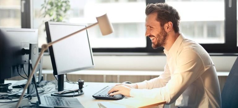 A man working on a computer in his office