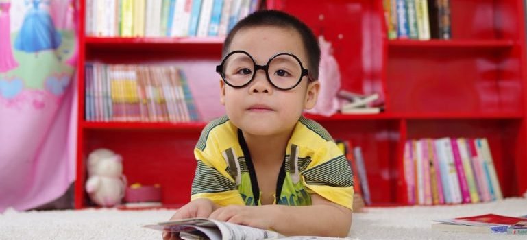 A child with black glasses