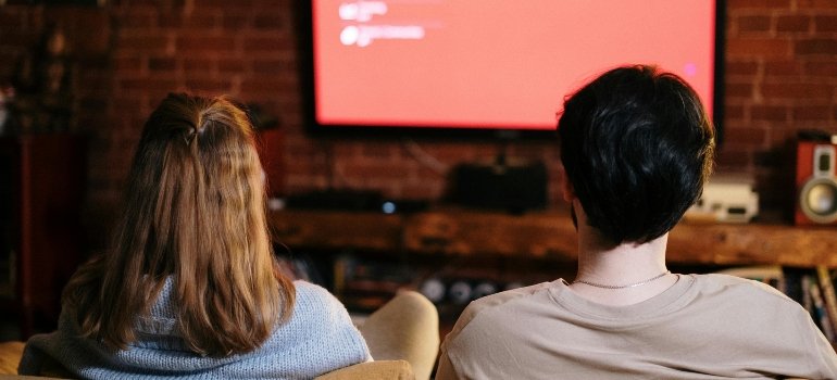 A couple watching TV.