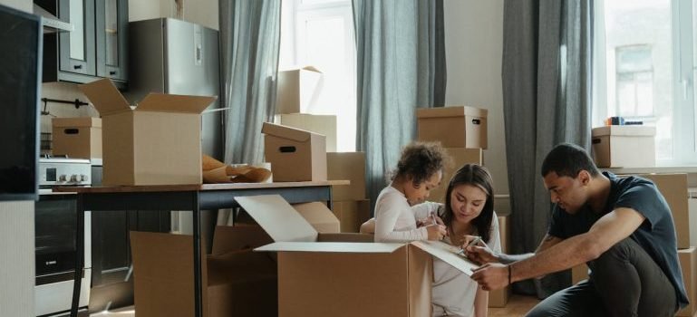 A family packing before transitioning from Manhattan to a larger home in Staten Island