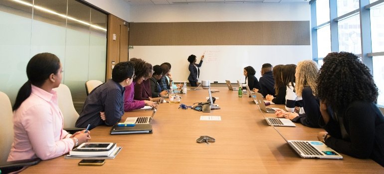 People having a meeting in an office.