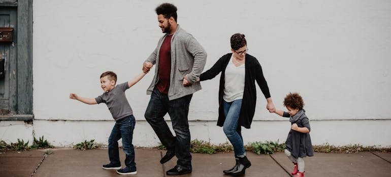 A family of four in NYC taking a walk as families are frequent storage users.