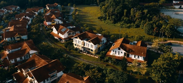 Aerial view of a suburban neighborhood with homes and lush greenery, offering a tranquil living environment.