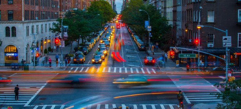 Fast-moving Brooklyn street at night, illustrating the dynamic environment new residents think about life in Brooklyn.