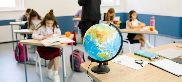 Classroom with children and a globe in Staten Island.