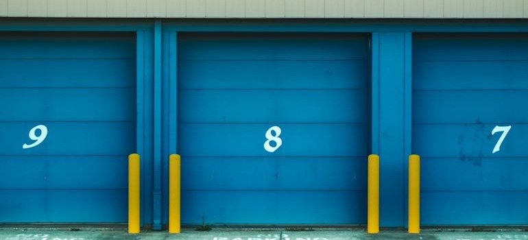 Blue doors to storage units where you can store your baby gear between kids.