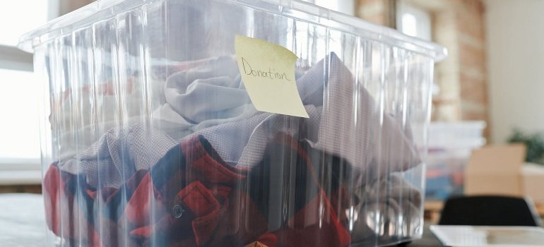 Clothes packed in clear plastic container.