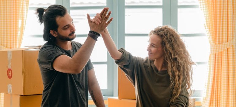 A couple giving each other a high five.