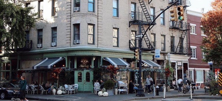 A charming New York City coffee shop on the city corner adds value to nearby profitable investment properties in Manhattan.