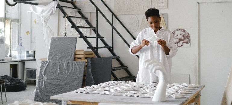 A woman making ceramic sculptures.