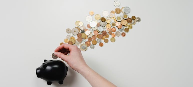 A piggy bank and a pile of coins.