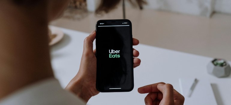 person using the ubereats app on their phone