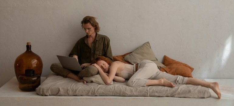 A couple enjoying a peaceful rest on a mattress.