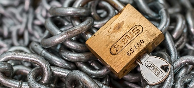 A sturdy padlock on chains – a symbol of secure short-term storage for busy young families.