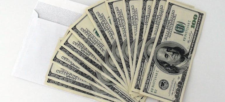 100 dollar bills symbolizing Cost-Effective Commercial Storage Solutions for NYC Companies.