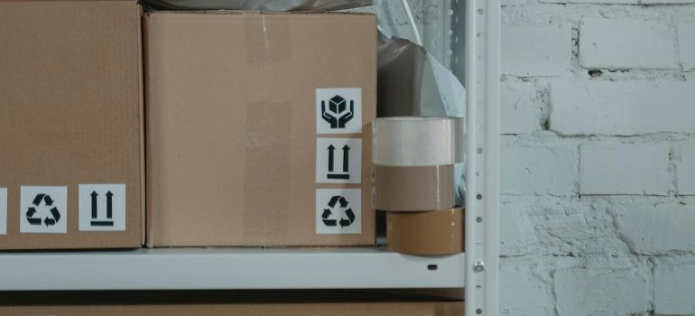 Cardboard boxes on a shelf.