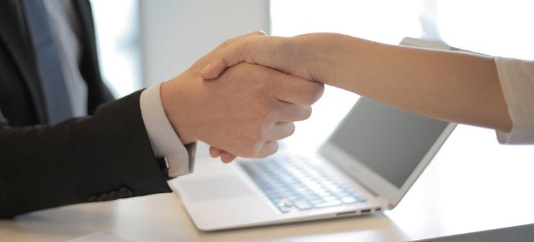 Two people shaking hands.