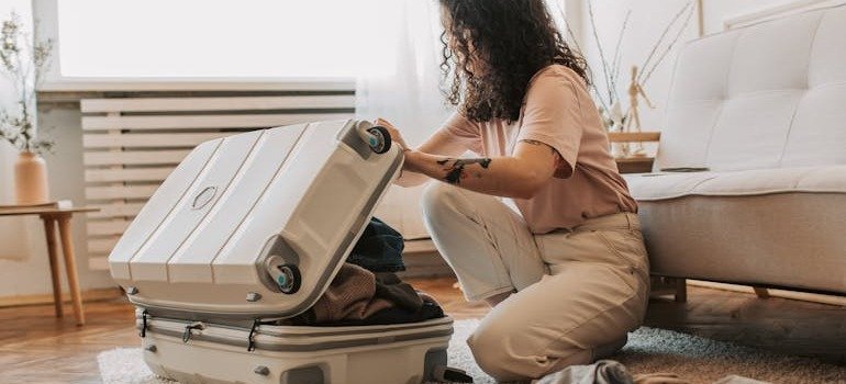 A woman packing for her travel.
