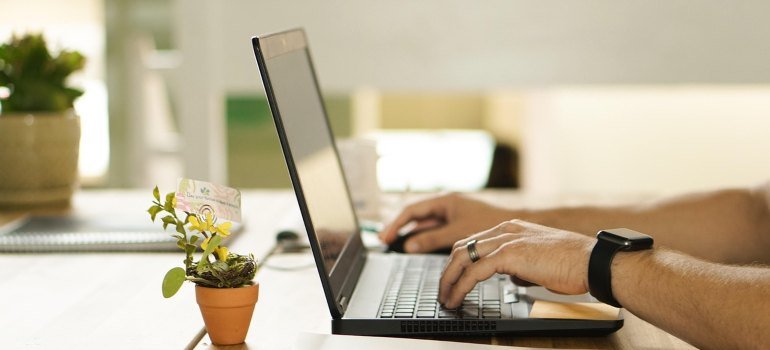 you can pay your storage bill just like the person on the photo using heir laptop to do the same