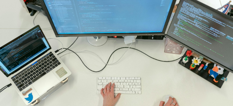A person working on some computers.
