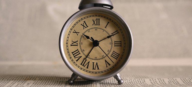 Classic analog alarm clock symbolizing urgency and approaching deadlines.