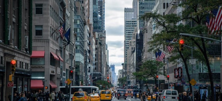 A street in NYC with cars and buildings.
