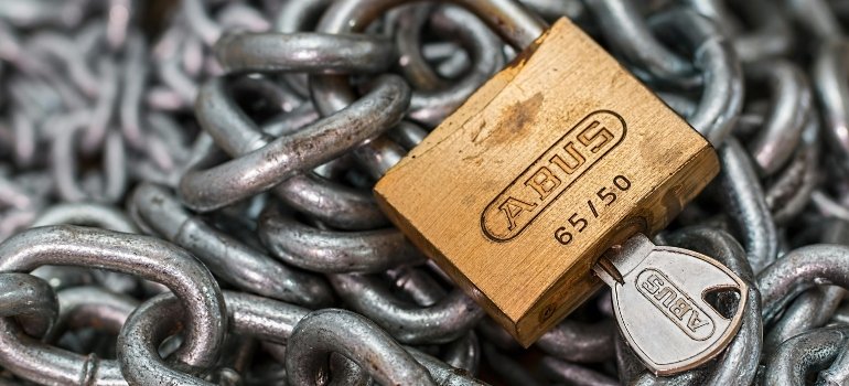 A sturdy padlock with chains illustrating strong asset security although storage location affects pricing.