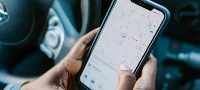 A man looking at a map on his phone.