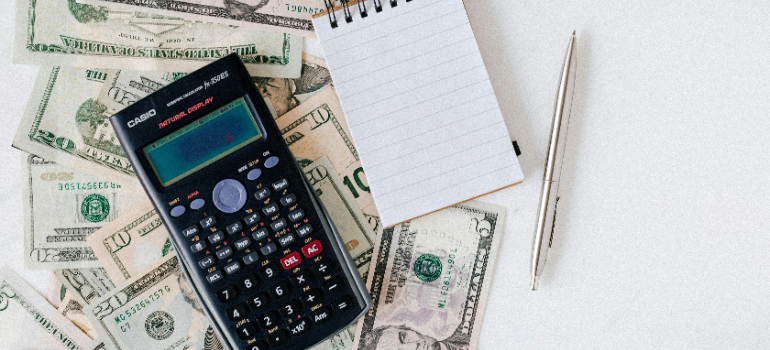 A calculator and money.