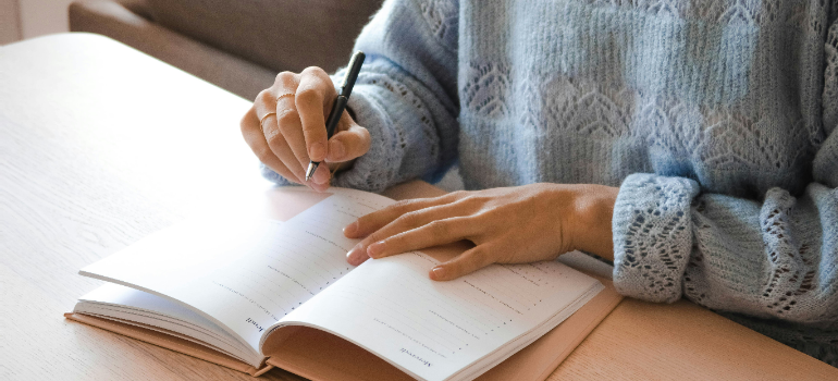 A person writing down a plan.