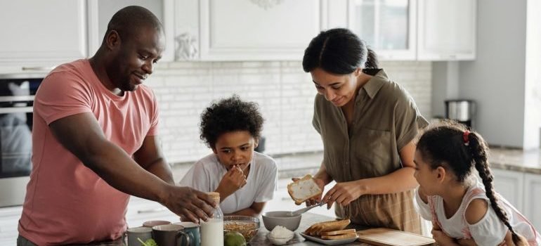 A family enjoying a meal in their new home.