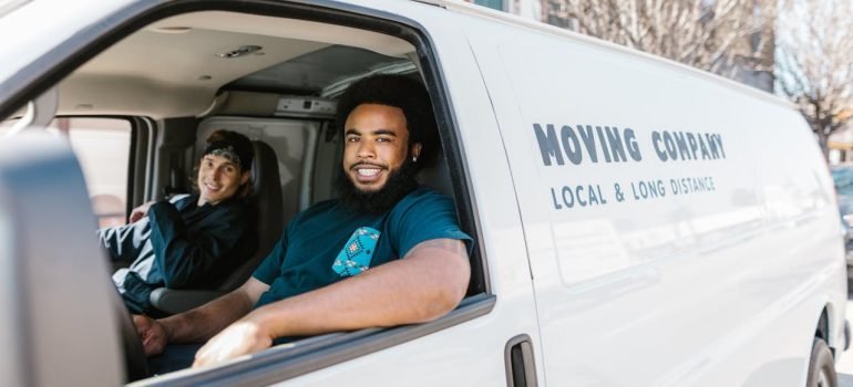 Professional movers in a moving van.