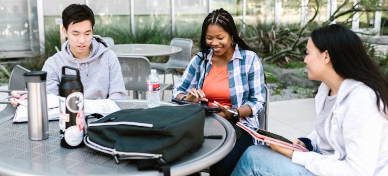 Friends talking about the best summer storage options for college students.