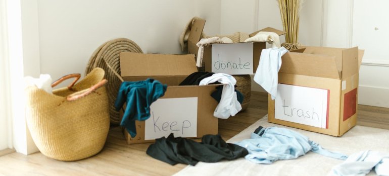Clothes in labeled boxes.