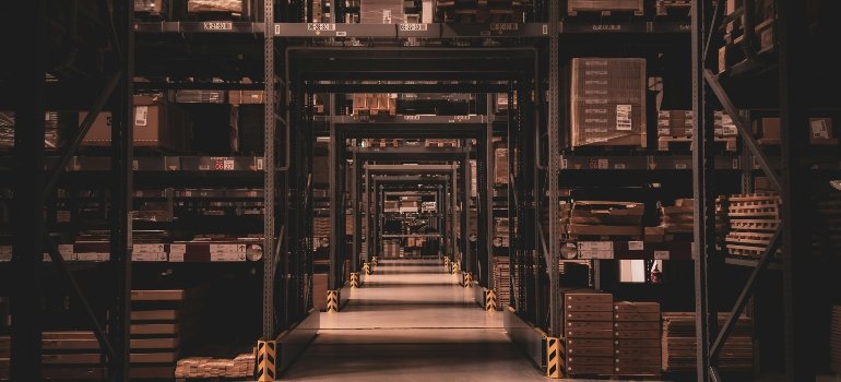 Shelves in a dark warehouse.