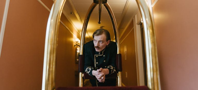 a hotel porter looking in the distance, cost-effective storage solutions for hotel owners