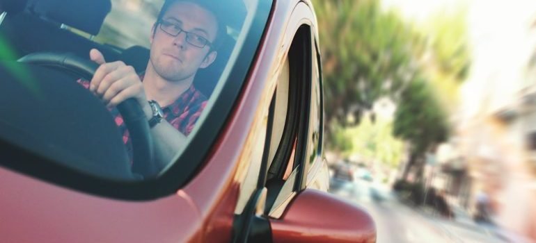 A communter in a car while commuting to Manhattan from the suburbs.