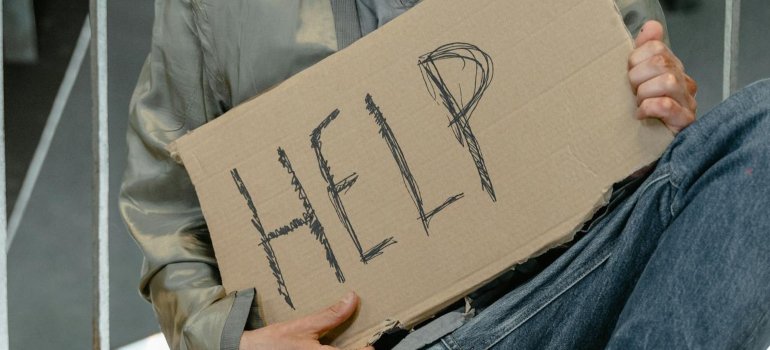 Person holding a sign.