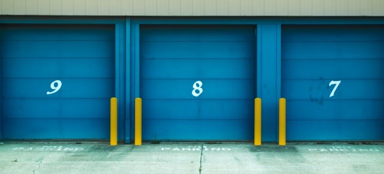Blue storage doors with yellow poles