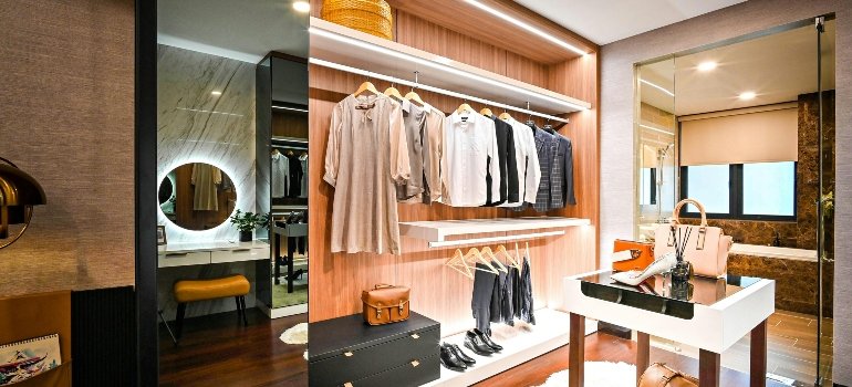 A wardrobe containing clothes