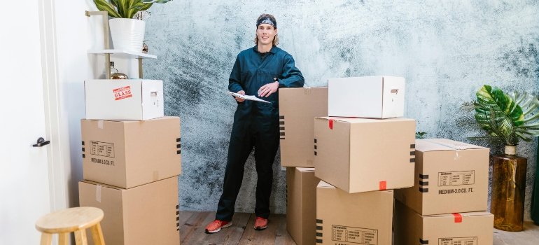 a boy trying putting shoes in storage in boxes