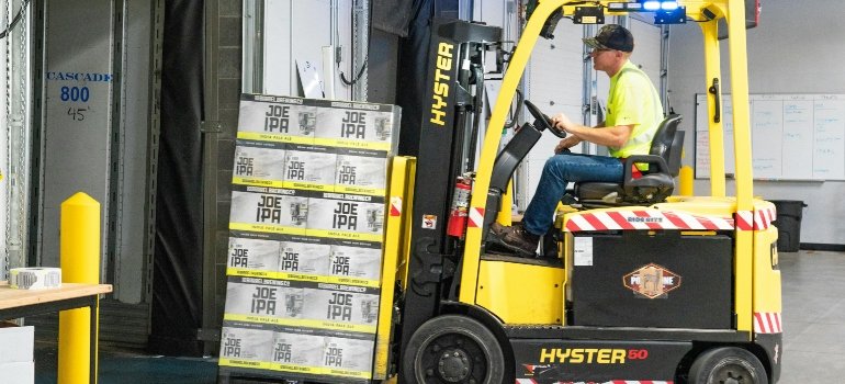 A man working in package storage making sure you do need to use your rights after storage unit theft or damage