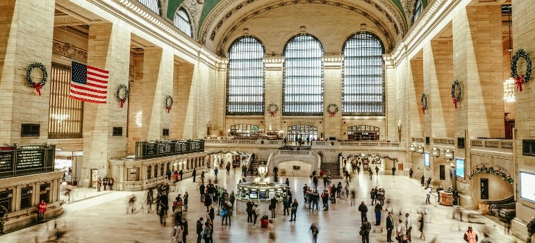 A people are walking inside the New York City building.