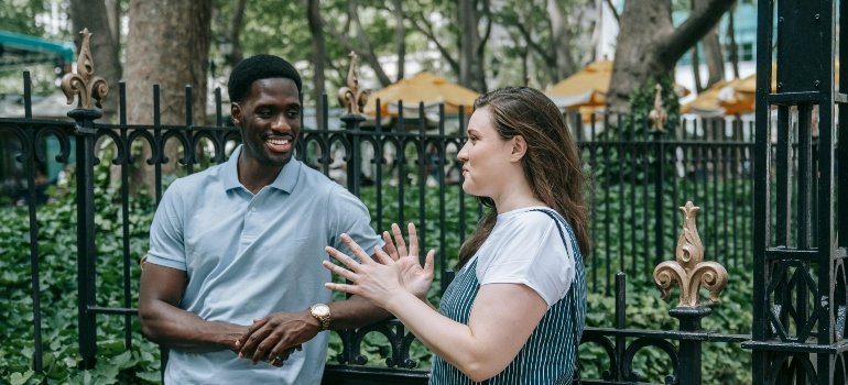 Two people are talking about the best ways to enjoy summer in Manhattan in the park.