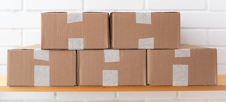 stacked boxes, save on storage in NYC this summer by using the most of your unit
