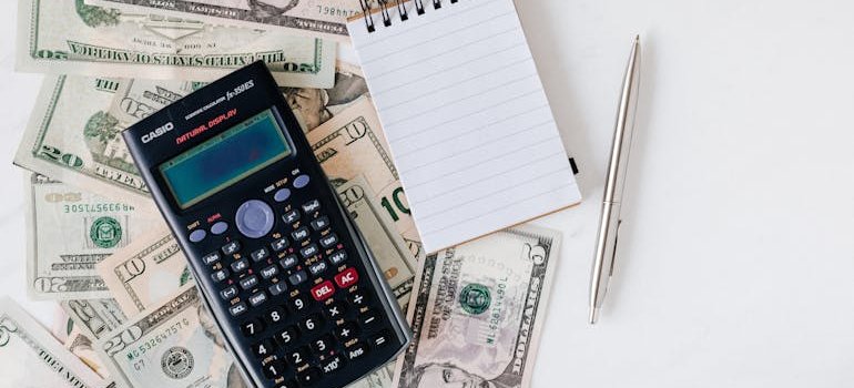 calculator on a pile of cash
